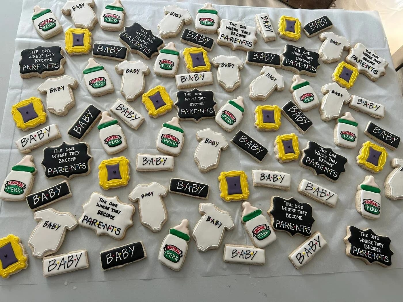 Friends TV show themed baby shower cookies - Central Perk, baby bottles, 'the one where they become parents' plaques