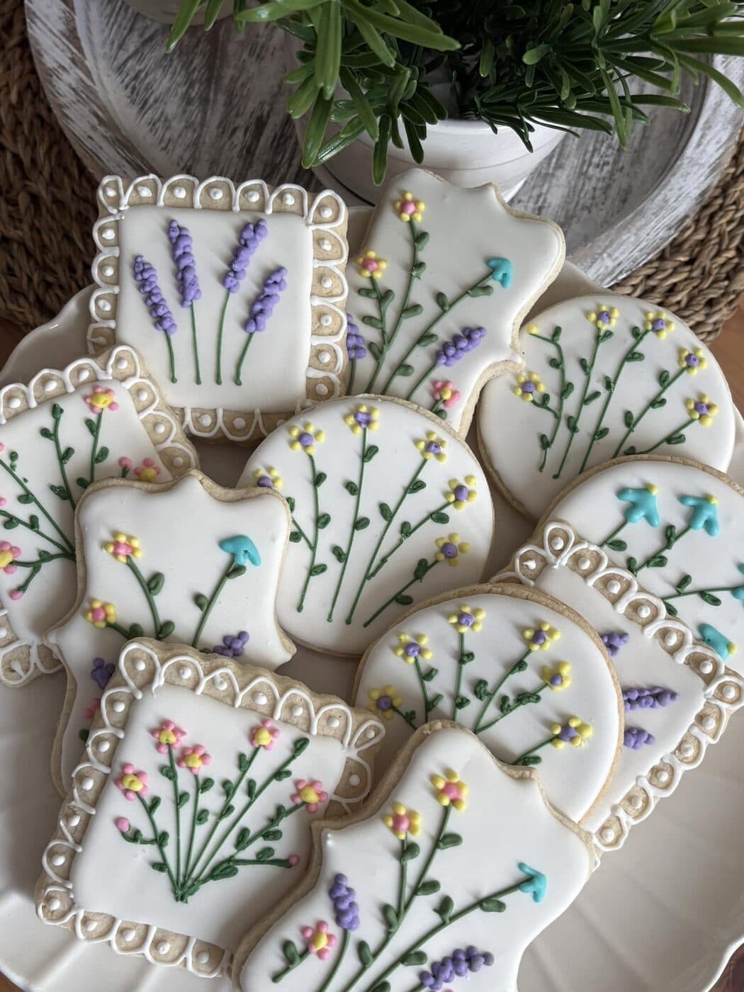 Hand-piped floral sugar cookies with lavender and pastel accents